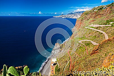 Winding road leading to the beach Ponta do Garajau Stock Photo