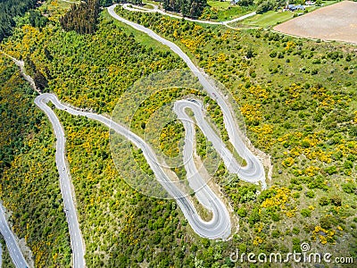 Winding road on mountain, Queenstown, New Zealand Stock Photo
