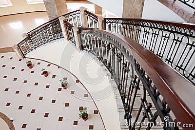 Winding staircase with forged rail Stock Photo