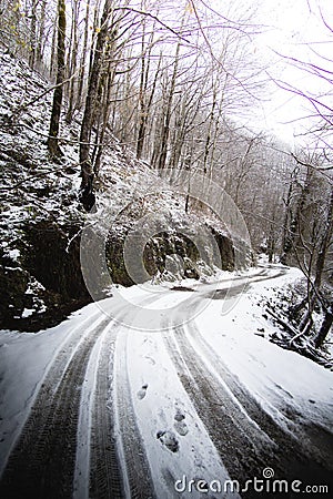 Winding winter road in the mountains Stock Photo