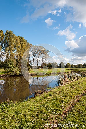 A windless autumn day at a narrow river Stock Photo