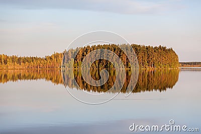 Windless evening at the lake with island reflection on water surface. Karelia, Russia. Horizontal image Stock Photo