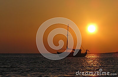 Sailing ship at sunset Stock Photo