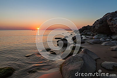 Windless weather an sunset on Baltic sea coast Stock Photo