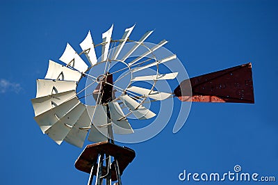 Windmill Against Blue Sky Stock Photo
