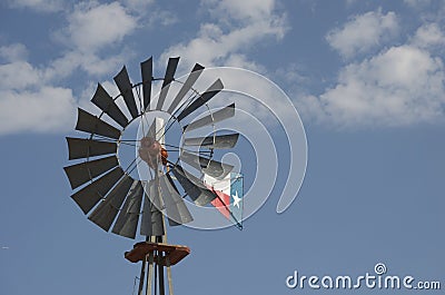 Windmill against blue Texas sky Stock Photo