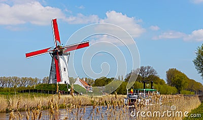 Windmill and canal cruise in Damme, West Flanders, Belgium Editorial Stock Photo