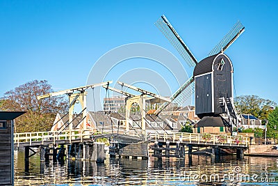 Traditional windmill and drawbridge in dutch city of Leiden Stock Photo