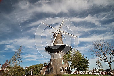 Windmill De Valk in the inner city of Leiden in the Netherlands, windmill have a museum in it and is part of the water works. Editorial Stock Photo