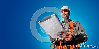 Windmill engineer planing new ecology project. He standing and look in tablet. Color studio background Stock Photo