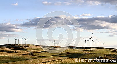 Windmill farm in beautiful landscape Stock Photo