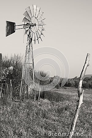 Black and white photo of a Windmill, winter field landscape photo in the Dome area near Parys. Free State Stock Photo