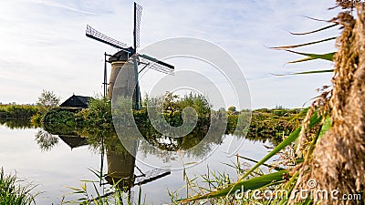 Windmill farm river landscape dutch windmill farm scene windmill farm scene Stock Photo