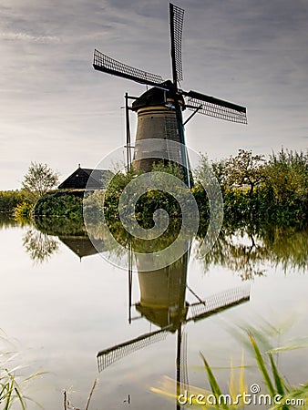 Windmill farm river landscape dutch windmill farm scene windmill farm scene Stock Photo