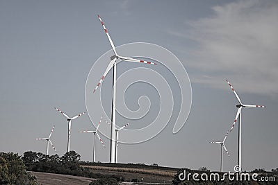 A windmill on a hillside. Green ecological power energy generation Stock Photo