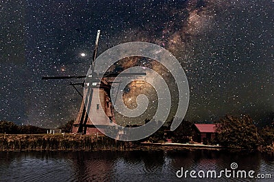 A Windmill and the milky way Stock Photo