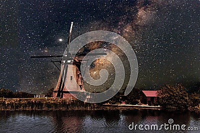A Windmill and the milky way Stock Photo