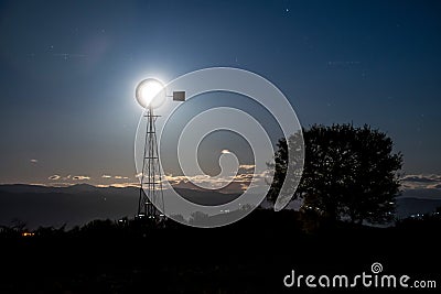 Windmill and moon Stock Photo