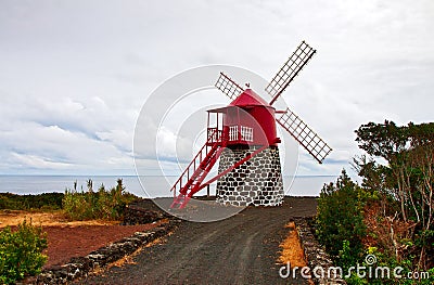 The windmill on the ocean Stock Photo