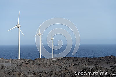 Windmill park in the seaside. Power Alternative generator by wind. Environmental Energy production in a bay. Ecology powered Stock Photo