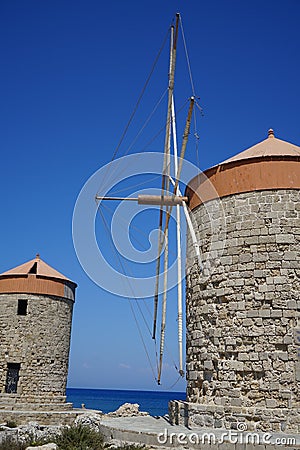 Windmill pier at the commercial harbor in Rhodes city. Rhodes, Greece Stock Photo