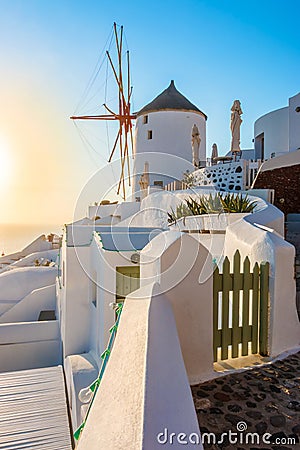 Windmill in sunset, Oia town, Santorini Stock Photo