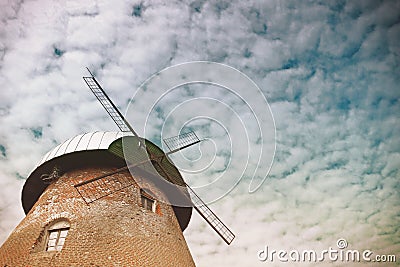Windmill under the cloudy sky Stock Photo