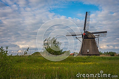Traditional dutch windmill and beautiful sky nearby Ophemert, Province of Gelderland, The Netherlands Stock Photo