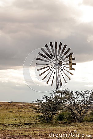 Windmills in the African savannah Stock Photo