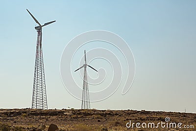 Windmills in the desert of India Stock Photo