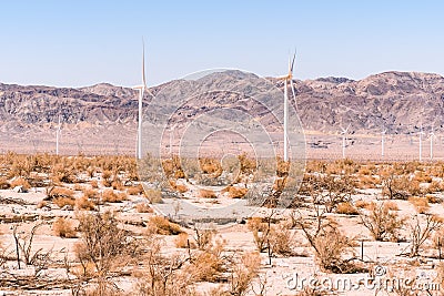 Windmills in Dry desert in southern california USA on bright hot day in summer Stock Photo