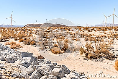 Windmills in Dry desert in southern california USA on bright hot day in summer Stock Photo
