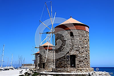 The Windmills of Mandraki Harbor - Rhodos Greece Stock Photo