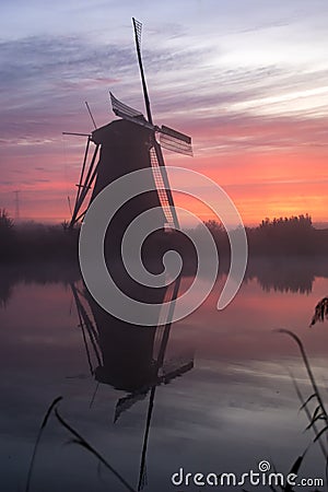 Windmills at sunset Stock Photo