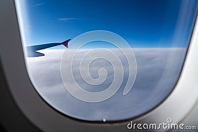 The window of the airplane. A view of porthole window on board an airbus for your travel concept Stock Photo