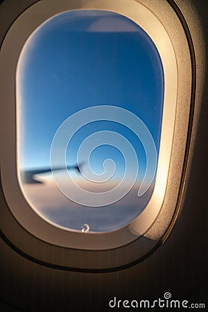 The window of the airplane. A view of porthole window on board an airbus for your travel concept Stock Photo