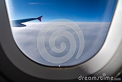 The window of the airplane. A view of porthole window on board an airbus for your travel concept Stock Photo