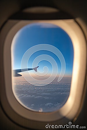 The window of the airplane. A view of porthole window on board an airbus for your travel concept Stock Photo