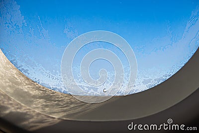 The window of the airplane. A view of porthole window on board an airbus for your travel concept or passenger air transportation Stock Photo