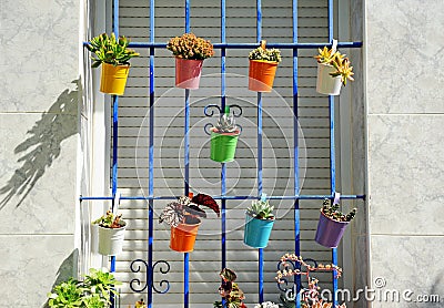 Andalusian house adorned with colored pots in Seville, Spain Stock Photo