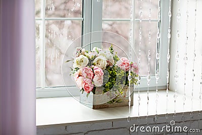 Window with curtains and flowers Stock Photo