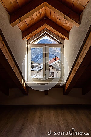 Window detail with a view of Swiss snow-capped mountains Stock Photo
