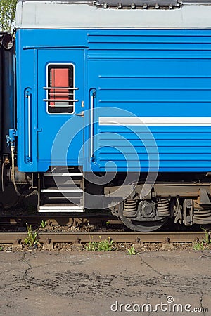 Window and door of the blue locomotive wagon. Stock Photo