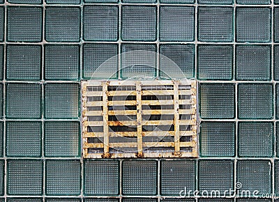 A window in a glass wall made of thick-walled batch cells Stock Photo