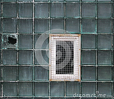 A window in a glass wall made of thick-walled batch cells Stock Photo