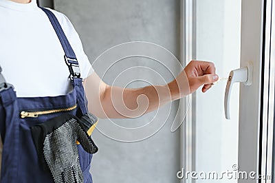 Window handle lock. Key locking window with key for kids safety. Window Restrictors in the home. Stock Photo