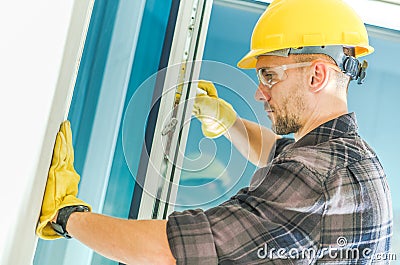 Window Installation by Worker Stock Photo