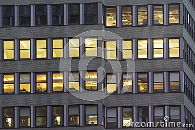 Window lights at night in city. Stock Photo