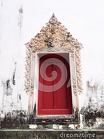 The window of the old temple at Wat-chom-phu-wek Thailand. Stock Photo