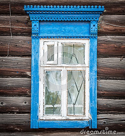 Window of old traditional russian wooden house. Stock Photo